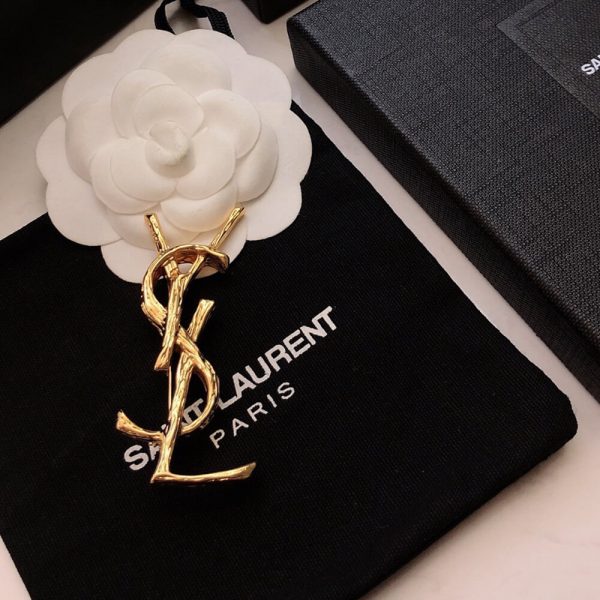 YSL CASSANDRE BROOCH IN METAL